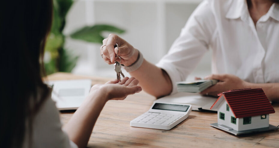 Successful completion of a property purchase, symbolizing the final stage of the real estate investment process in the UK.