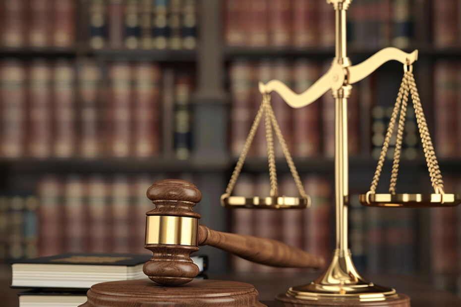Gavel, justice scales, and law books symbolising legal services in the UK, including immigration, GDPR compliance, and regulatory matters.
