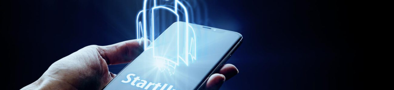Advantage Investments – Company Formation and Business Setup Services. Startup concept with a rocket hologram emerging from a smartphone, symbolising company formation and business setup services.